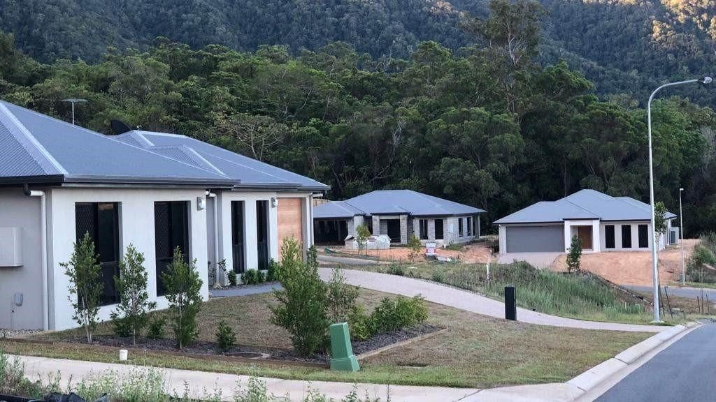Housing development surrounded by Papua New Guinea landscape